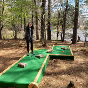 Young woman playing Gorilla golf at Go ape outdoor adventure park memphis