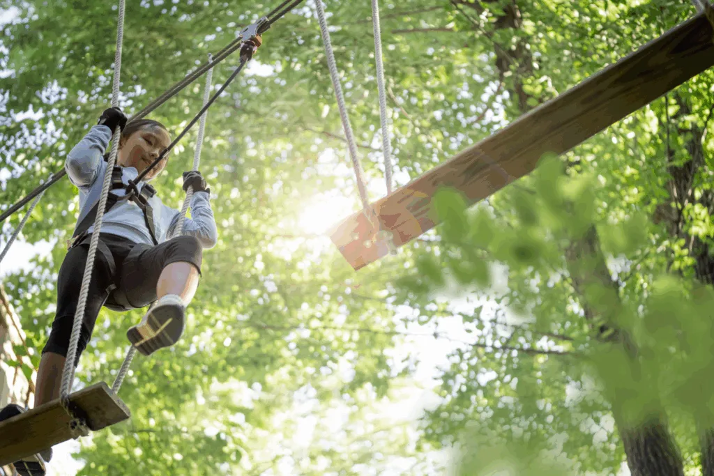 Child ziplining through the trees at Go Ape Treetop Adventure in Springfield, Virginia, near Washington DC