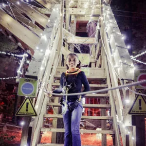 Young girl smiling at Go Ape outdoor adventure ropes course Kansas City