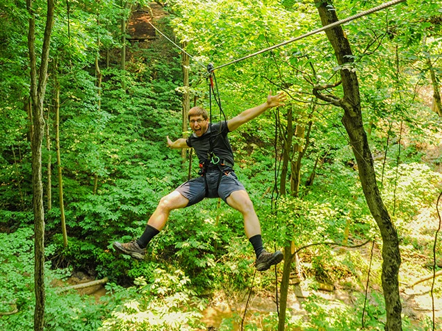 Man shows off ziplining skills