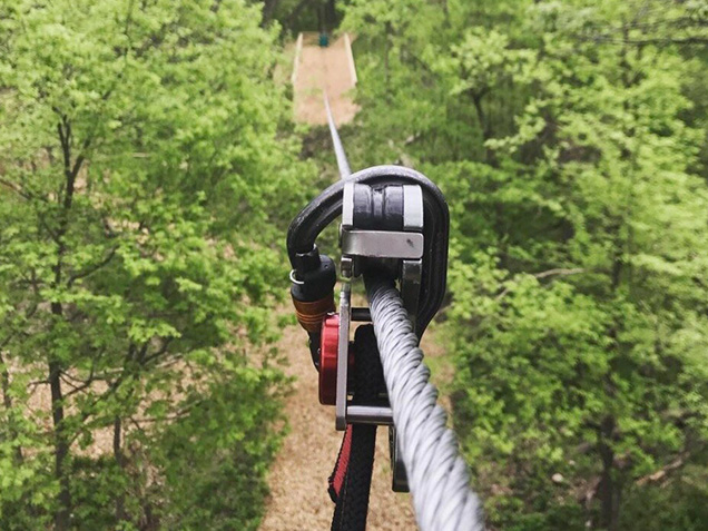 Point of view looking down a long zipline