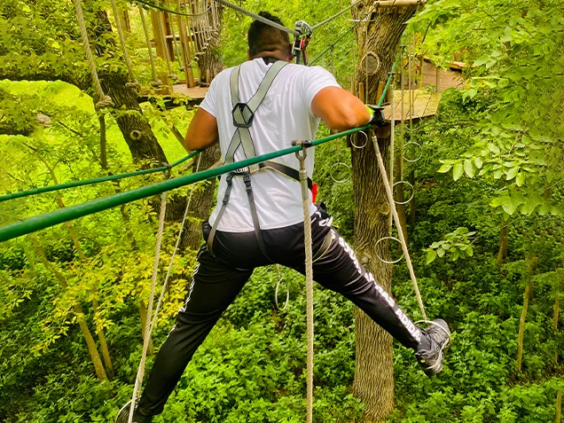 Man enjoying Go Ape outdoor adventure ropes course Omaha-Lincoln