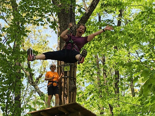 Gleeful woman on a zipline