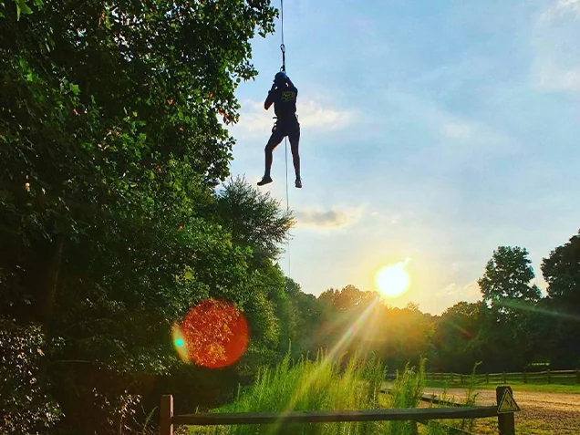 Man ziplines at Go Ape zipline St Louis