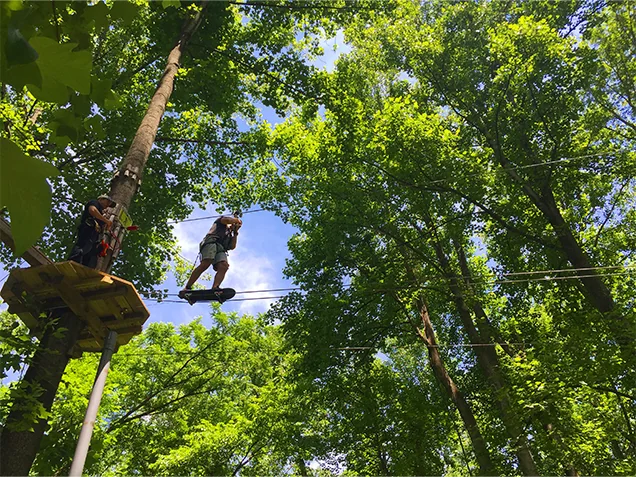 Man enjoying Go Ape outdoor adventure ropes course Chicago