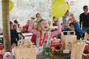 Girl with party hat and balloon