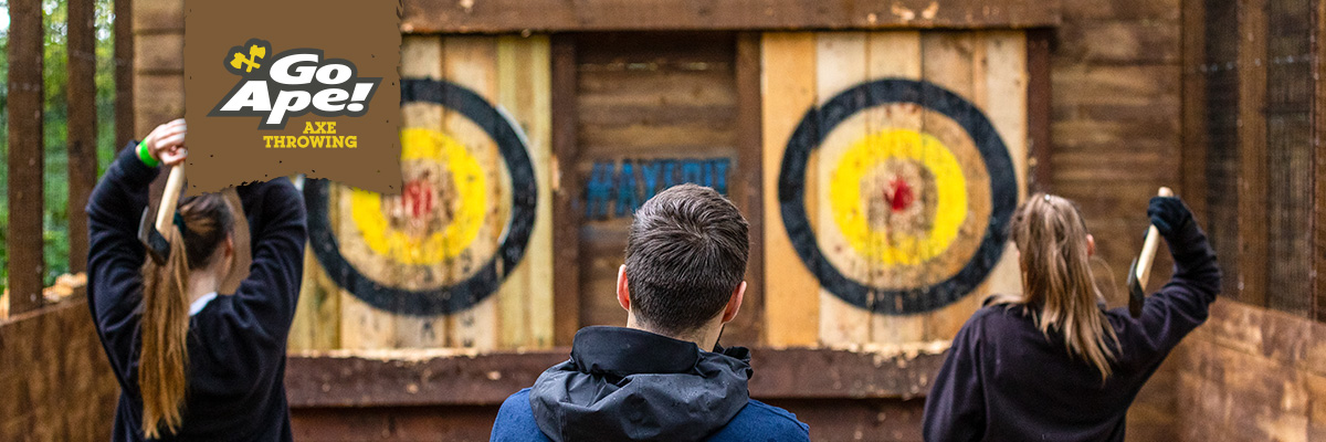Instructor supervising outdoor axe throwing