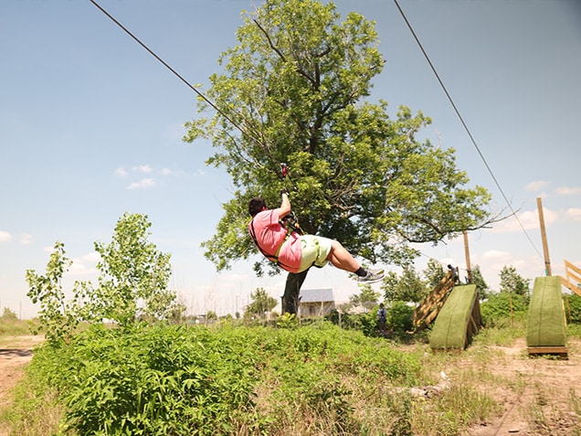 Man going down a zipline at Go Ape Zipline Houston