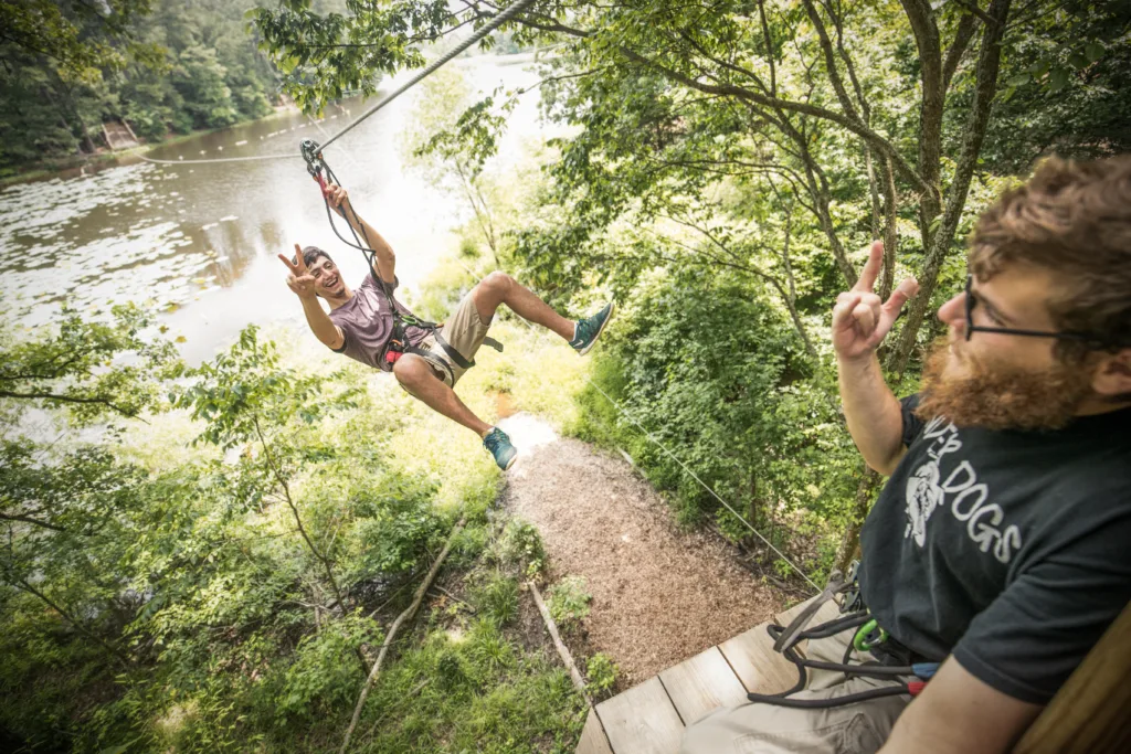 High ropes and ziplining at Go Ape Zipline and Adventure Park. Two adventurers experiencing fun near you!